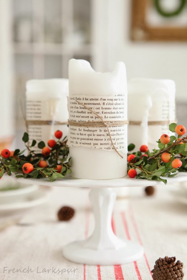 christmas cake stand with candles and garnsih 