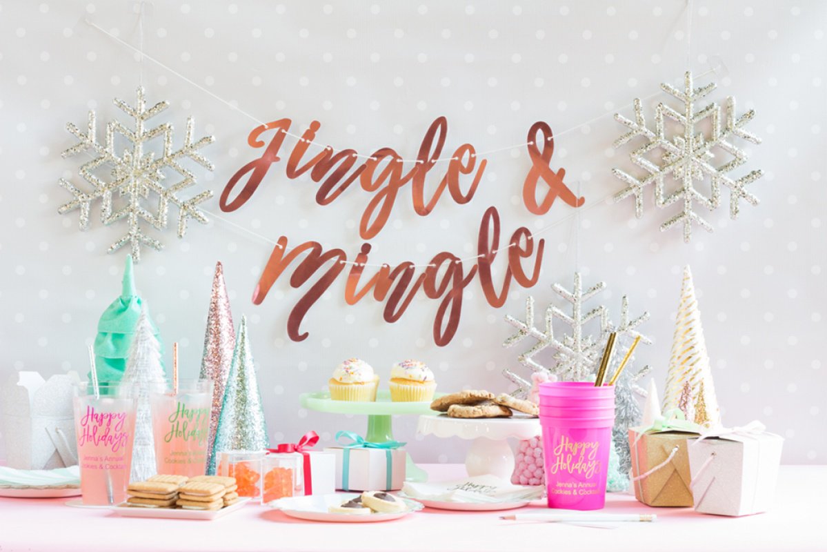 A kitsch Christmas party with glitter Christmas trees, cookies, snowflakes, and aqua and pink Christmas details. 