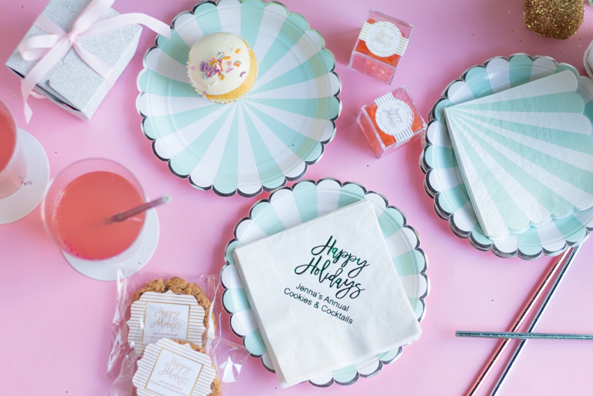 Aqua scalloped plates, personalized holiday napkins and cookies for a kitsch Christmas. 