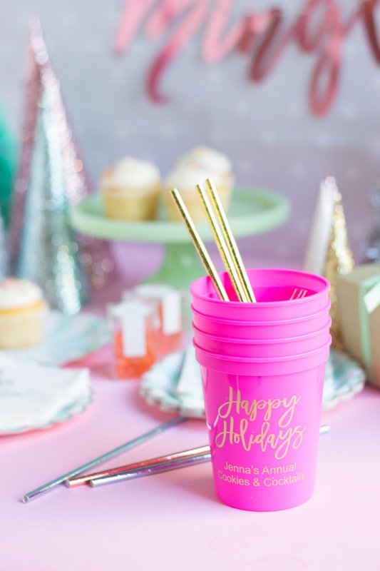 Pink Christmas cups with gold straws for a kitsch Christmas. 